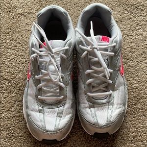 Women nikes w/ pink logo sign